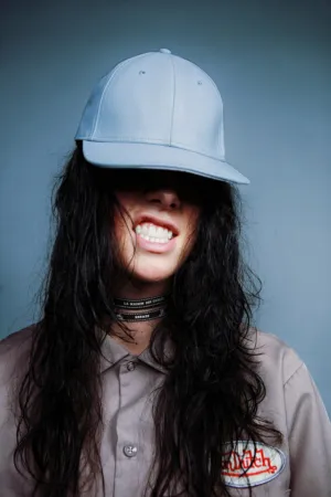 Person In Light Blue Cap