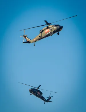 Military Helicopters In Flight