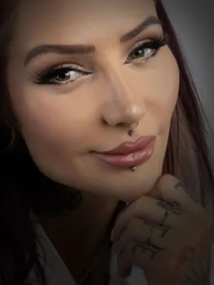 Portrait Of A Woman With Tattoos And Piercings