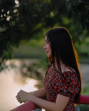 Pensive Woman By The Water