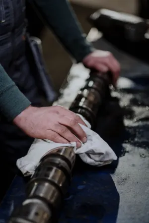 Mechanic Working On Engine Parts