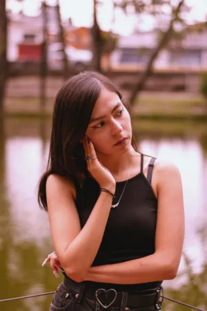 Pensive Teenager By The Water