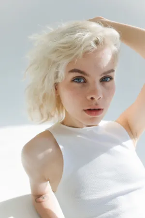 Blonde Model In White Top