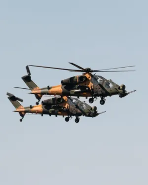 Military Helicopters In Flight