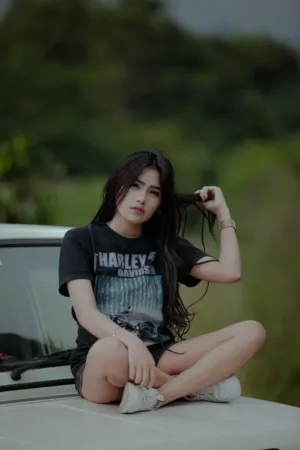 Young Woman In Black Harley-Davidson T-Shirt