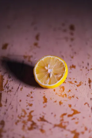 Sliced Lemon On Wooden Surface