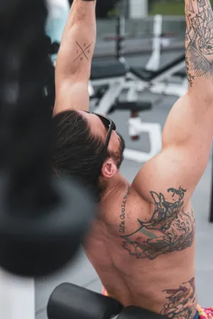 Tattooed Man Working Out
