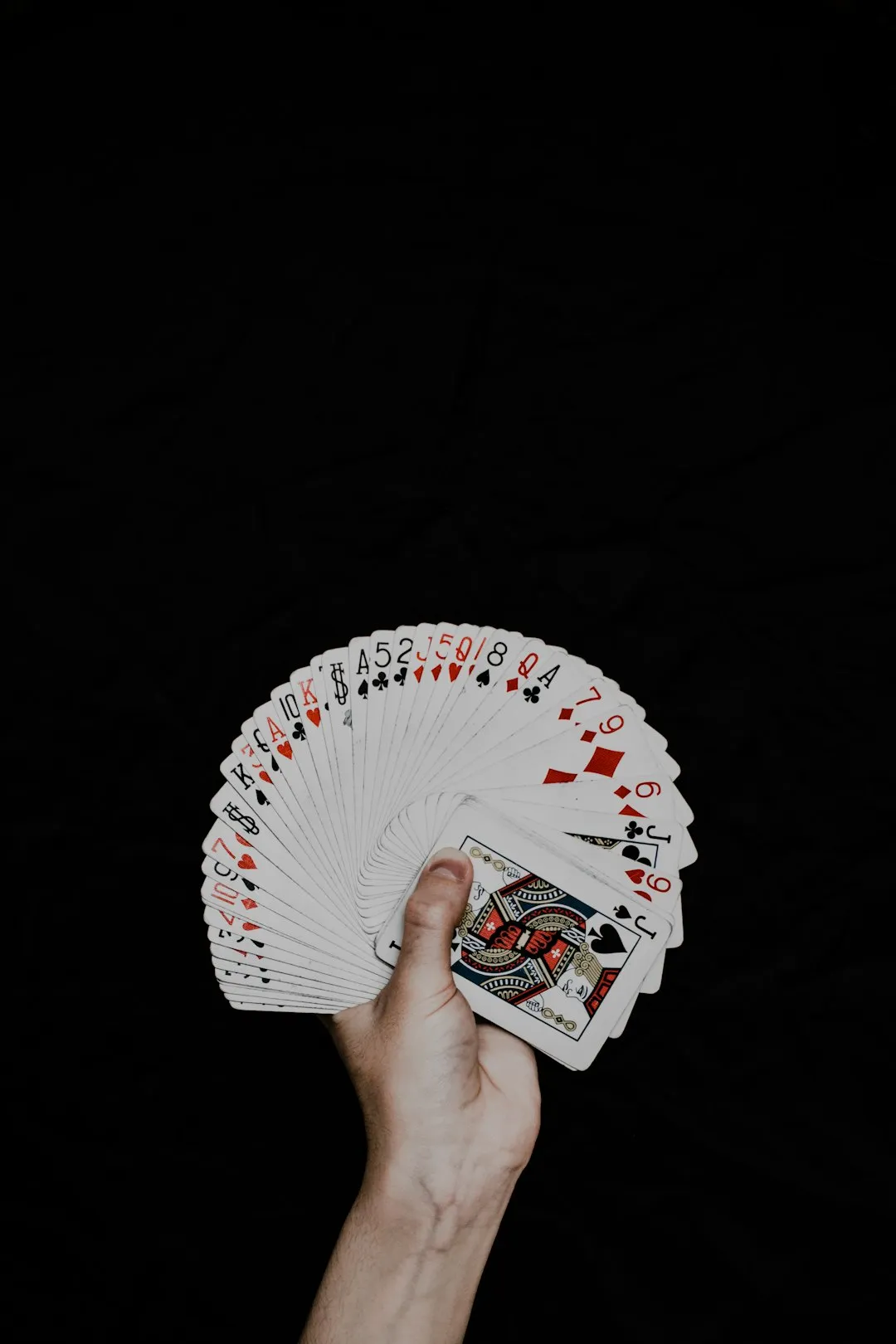 Hand Holding Playing Cards