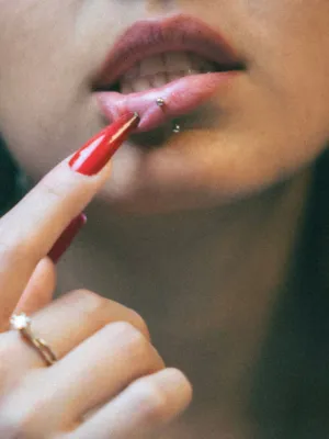 Red Nails And Lip Piercing