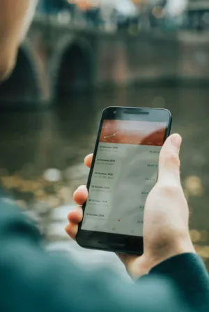 Hand Holding Smartphone With Channel Views