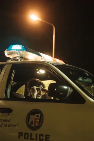 Police Officer In Patrol Car
