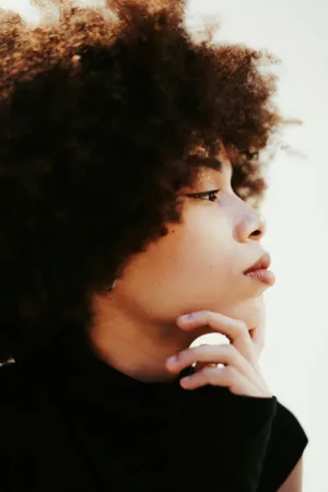 Portrait Of A Woman With Curly Hair
