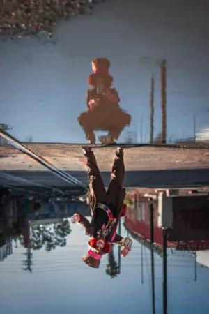 Puddle Reflection Of A Clown
