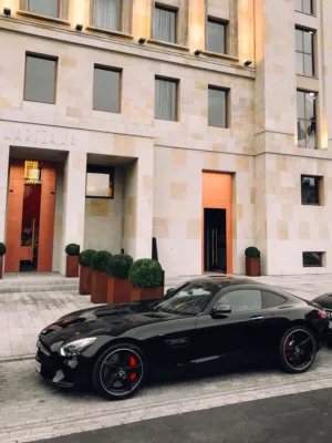 Black Luxury Car In Front Of Building