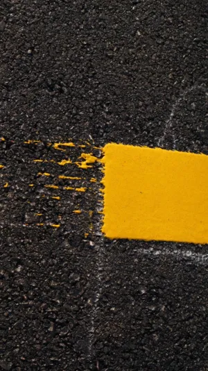 Yellow Paint On Black Surface