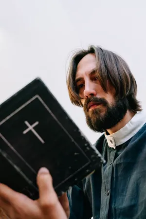 Man With Beard Holding A Book