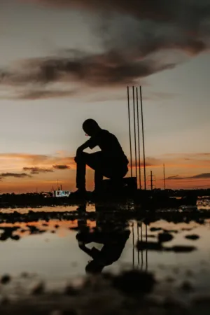 Silhouette Of A Man At Sunset
