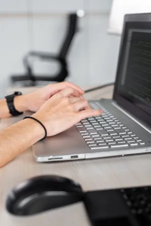 Person Typing On Laptop