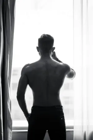 Shirtless Man By Window