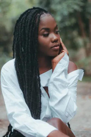 Portrait Of A Woman With Braids