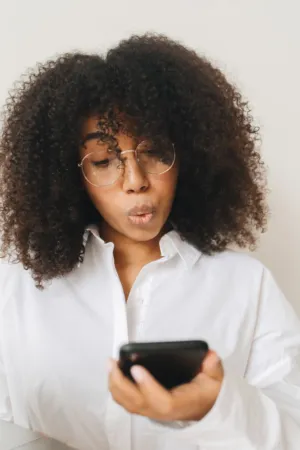 Curly-Haired Woman With Glasses