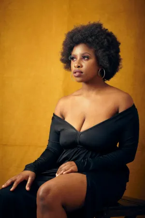 Black Woman In Off-The-Shoulder Dress