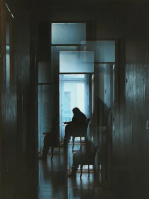 Silhouette In Dark Hallway