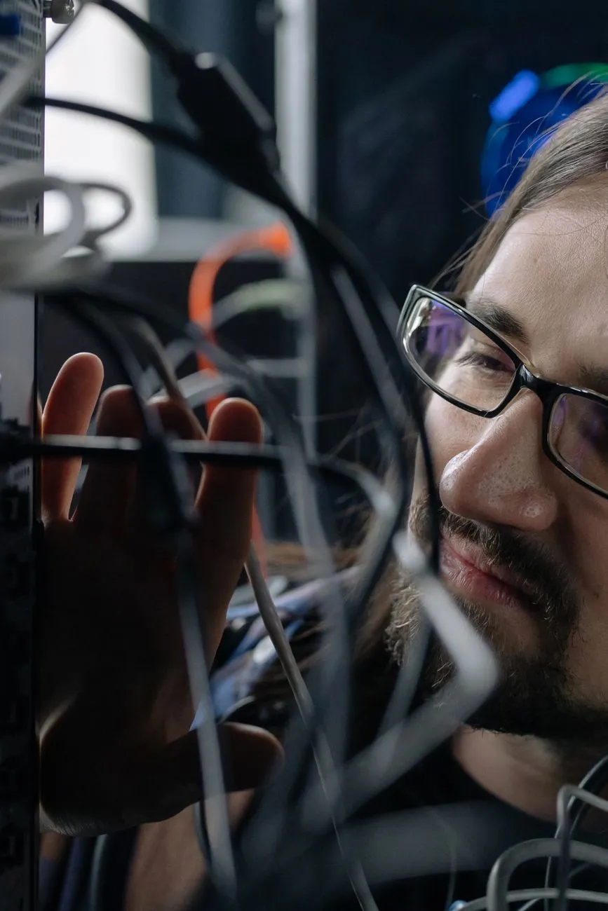 Tech Professional Working With Cables