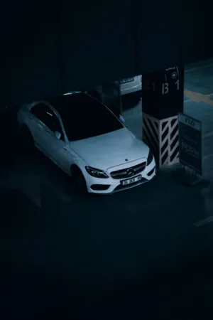 White Car In Dark Parking Garage