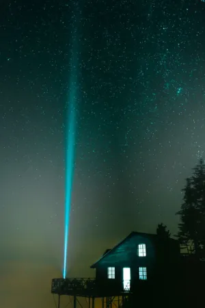 Starry Night With Lighthouse Beam