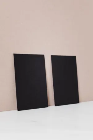 Black Cards On A Beige Background