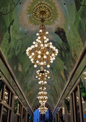 Grand Chandelier In A Glass Passage