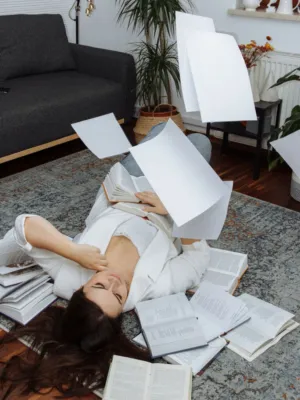 Woman Studying With Books And Papers