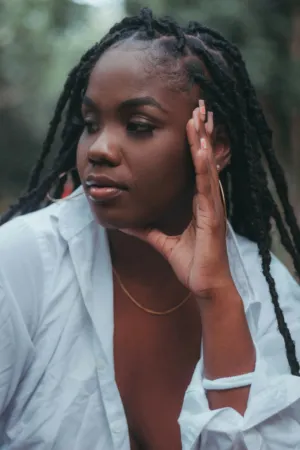 Portrait Of A Woman With Braids
