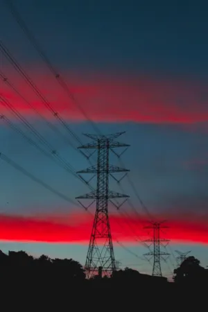 Electricity Pylons At Sunset