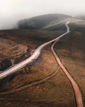 Winding Road Through Misty Hills