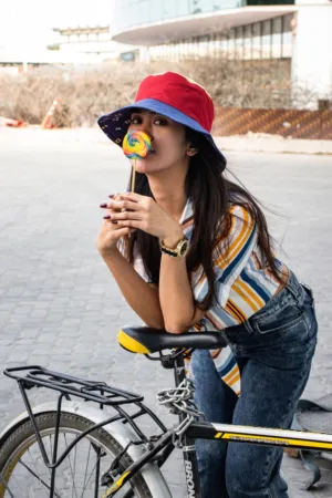 Urban Cyclist With Colorful Lollipop