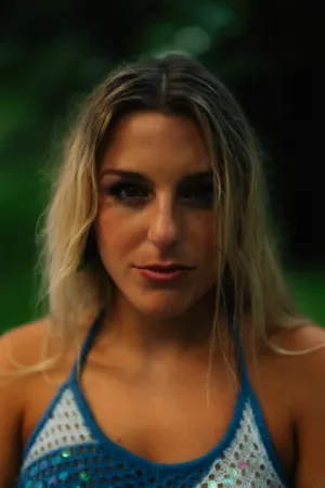 Blonde Woman In Blue And White Top