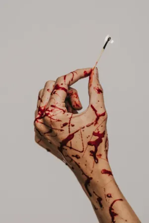 Bloody Hand Holding A Match