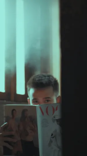 Young Man With Vogue Magazine