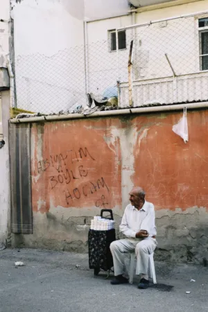 Man Sitting In Alley