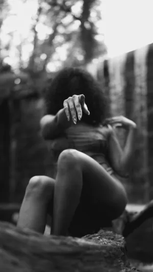Crouching Figure In Nature