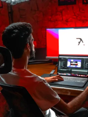 Man Working On Laptop And Computer