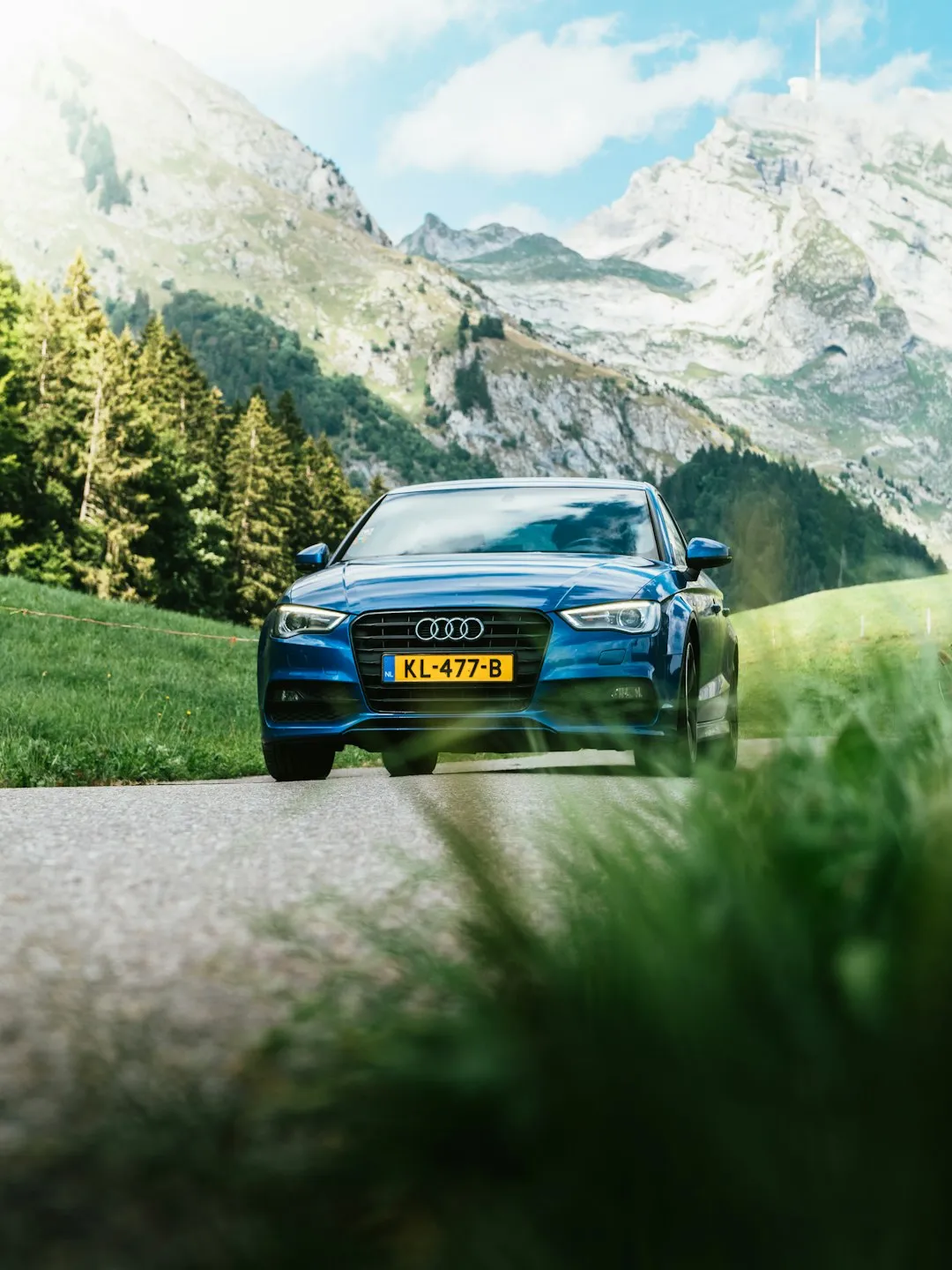 Blue Audi On Mountain Road