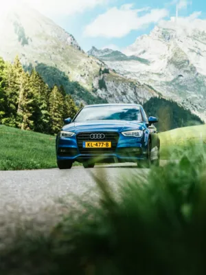 Blue Audi On Mountain Road