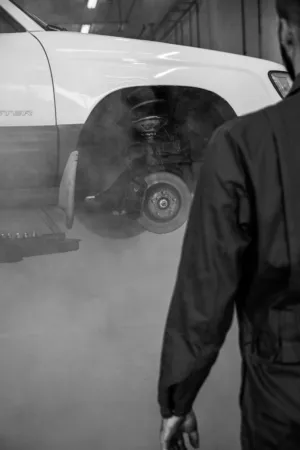 Mechanic Inspecting A Vehicle
