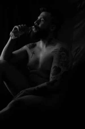 Tattooed Man Drinking Water