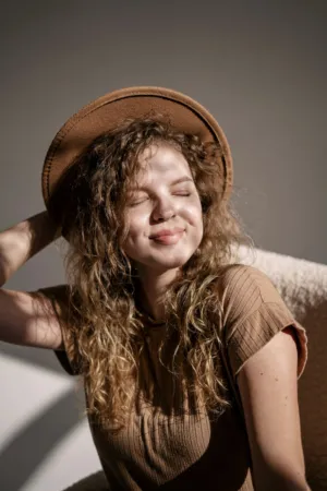 Happy Woman In Brown Outfit