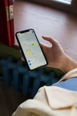Person Holding Smartphone With Chat App