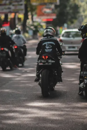 Motorcycle Riders On Busy Street